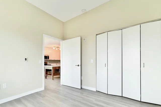 a view of a livingroom with furniture and wooden floor