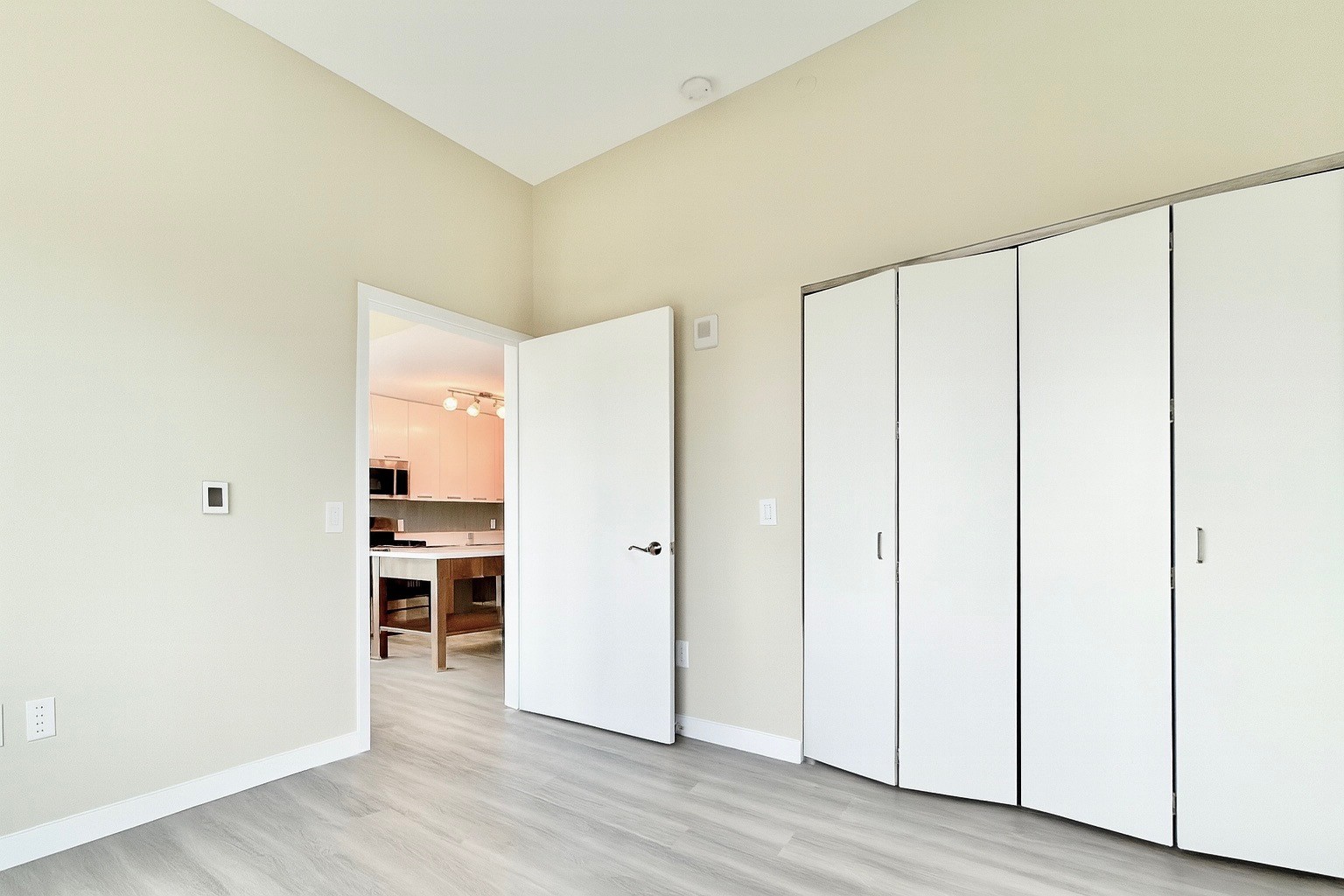 1524 Sheepshead Bay Road, Unit 3C Brooklyn, NY 11235 - Photo 6 of 25 a view of a kitchen with wooden floor