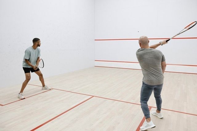 a view of a a dining room with furniture window and wooden floor