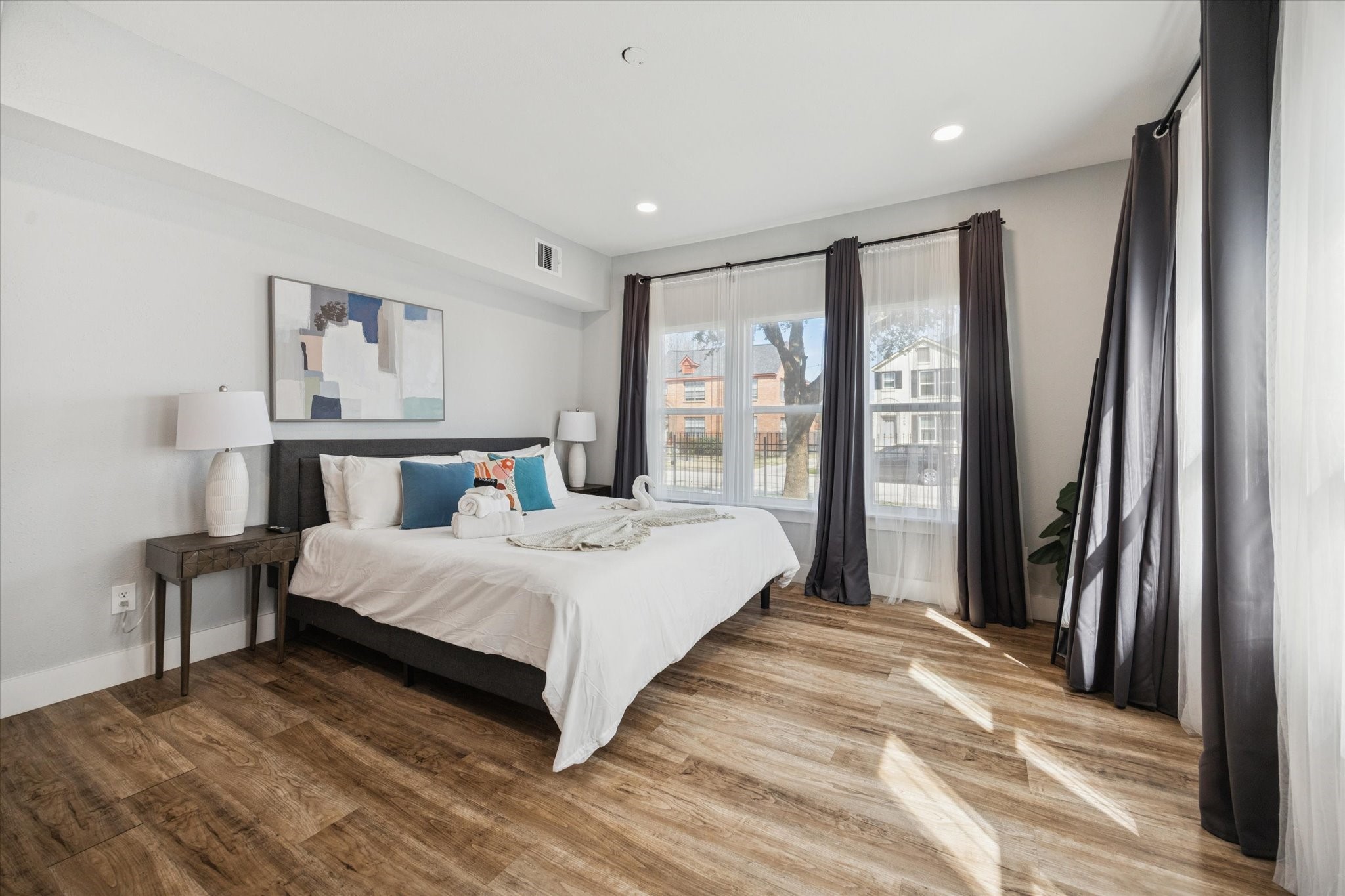 2410 Truxillo Street Houston, TX 77004 - Photo 11 of 41 Unit A (2-Bedroom): Bright primary bedroom with generous proportions, neutral finishes, and views that enhance the open and airy atmosphere.