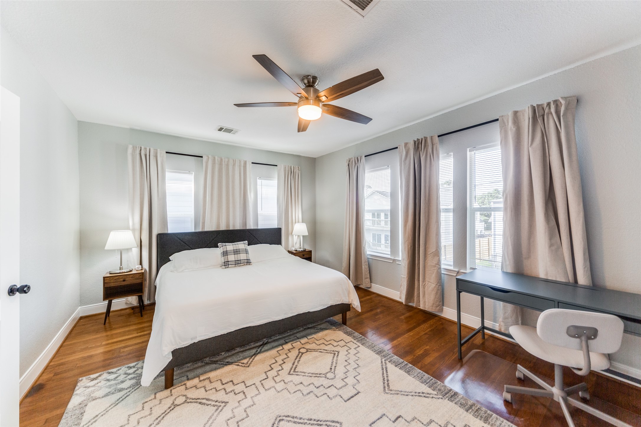 2410 Truxillo Street Houston, TX 77004 - Photo 21 of 41 Unit B (3-bedroom): Large bedroom with hardwood flooring, ceiling fan, and wonderful natural light.