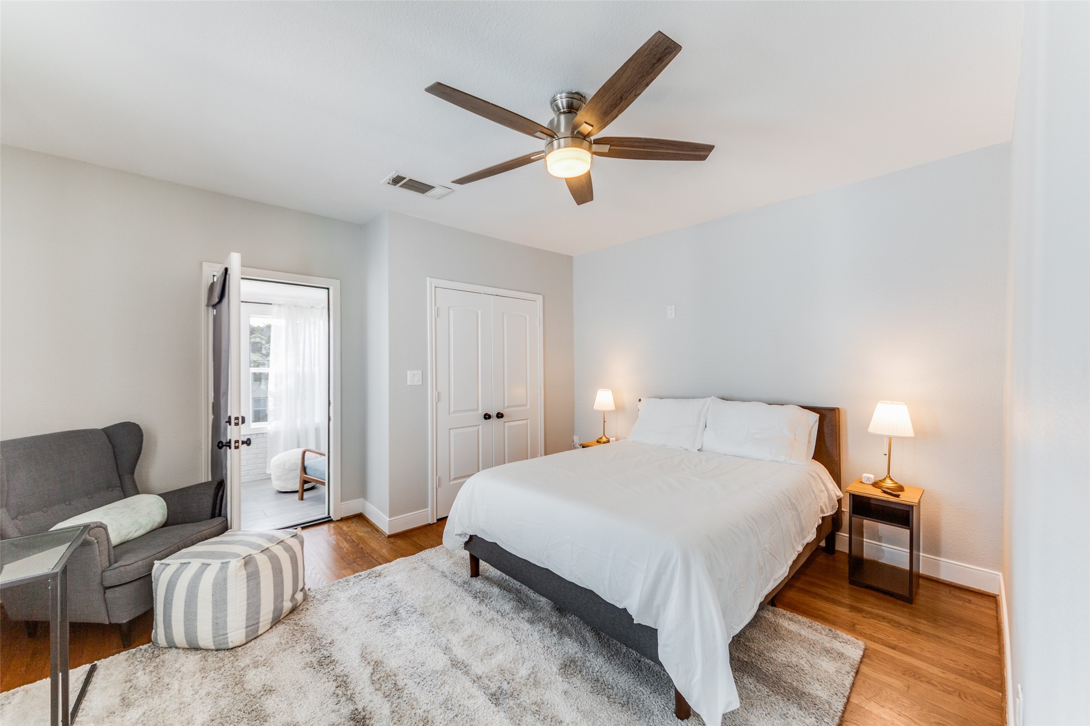 2410 Truxillo Street Houston, TX 77004 - Photo 24 of 41 Unit B (3-bedroom): Third bedroom with generous proportions, natural light, and versatile functionality for bedroom, office, or flex space. Direct access to sunroom creating a private and relaxing retreat.