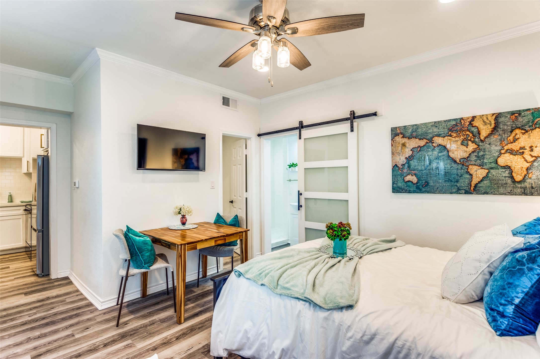 2410 Truxillo Street Houston, TX 77004 - Photo 31 of 41 Unit C (Studio): Versatile studio layout accommodates bedroom and lounge furnishings comfortably, complemented by ceiling fan, recessed lighting, and contemporary barn door leads to the bath.