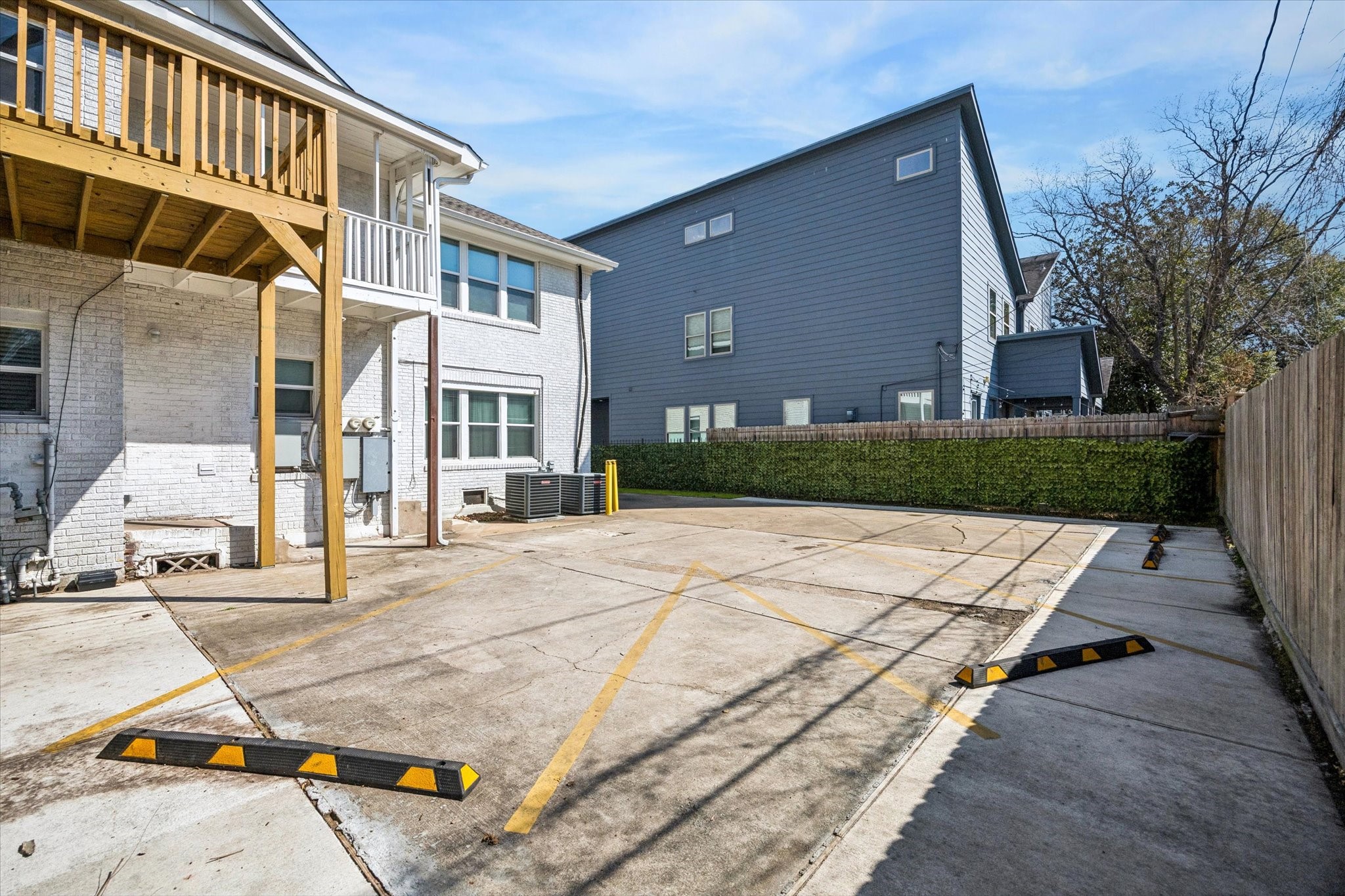 2410 Truxillo Street Houston, TX 77004 - Photo 37 of 41 Spacious rear parking area provides four dedicated parking spaces for tenants, complemented by well-maintained concrete surfaces and easy access to units.