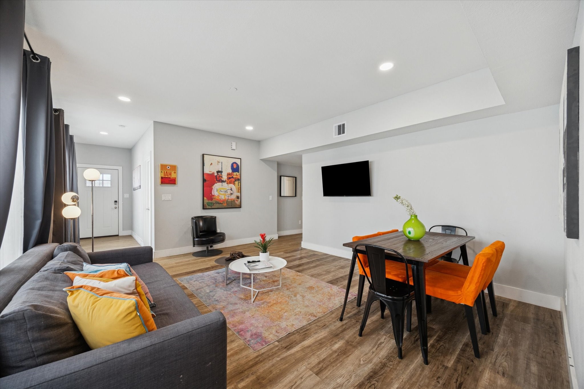 2410 Truxillo Street Houston, TX 77004 - Photo 4 of 41 Unit A (2-Bedroom): Spacious open-concept living and dining area offering flexible furniture placement, recessed lighting, and a seamless flow into the kitchen.