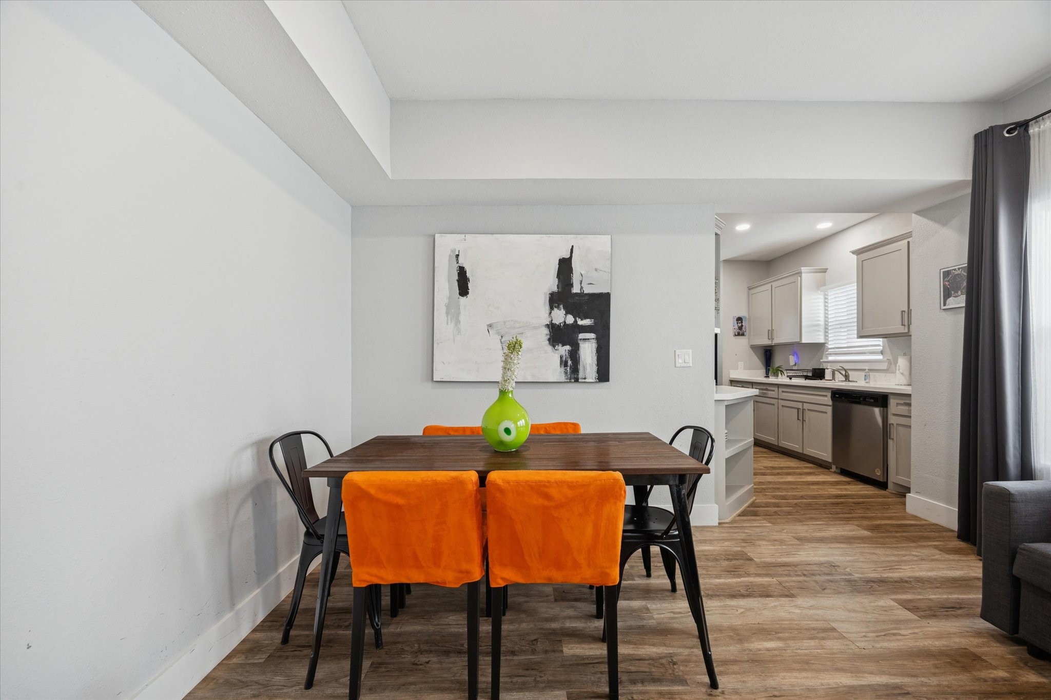 2410 Truxillo Street Houston, TX 77004 - Photo 7 of 41 Unit A (2-Bedroom): Dedicated dining space featuring modern flooring, contemporary lighting, and stylish accent wall art — ideal for everyday meals or entertaining guests.