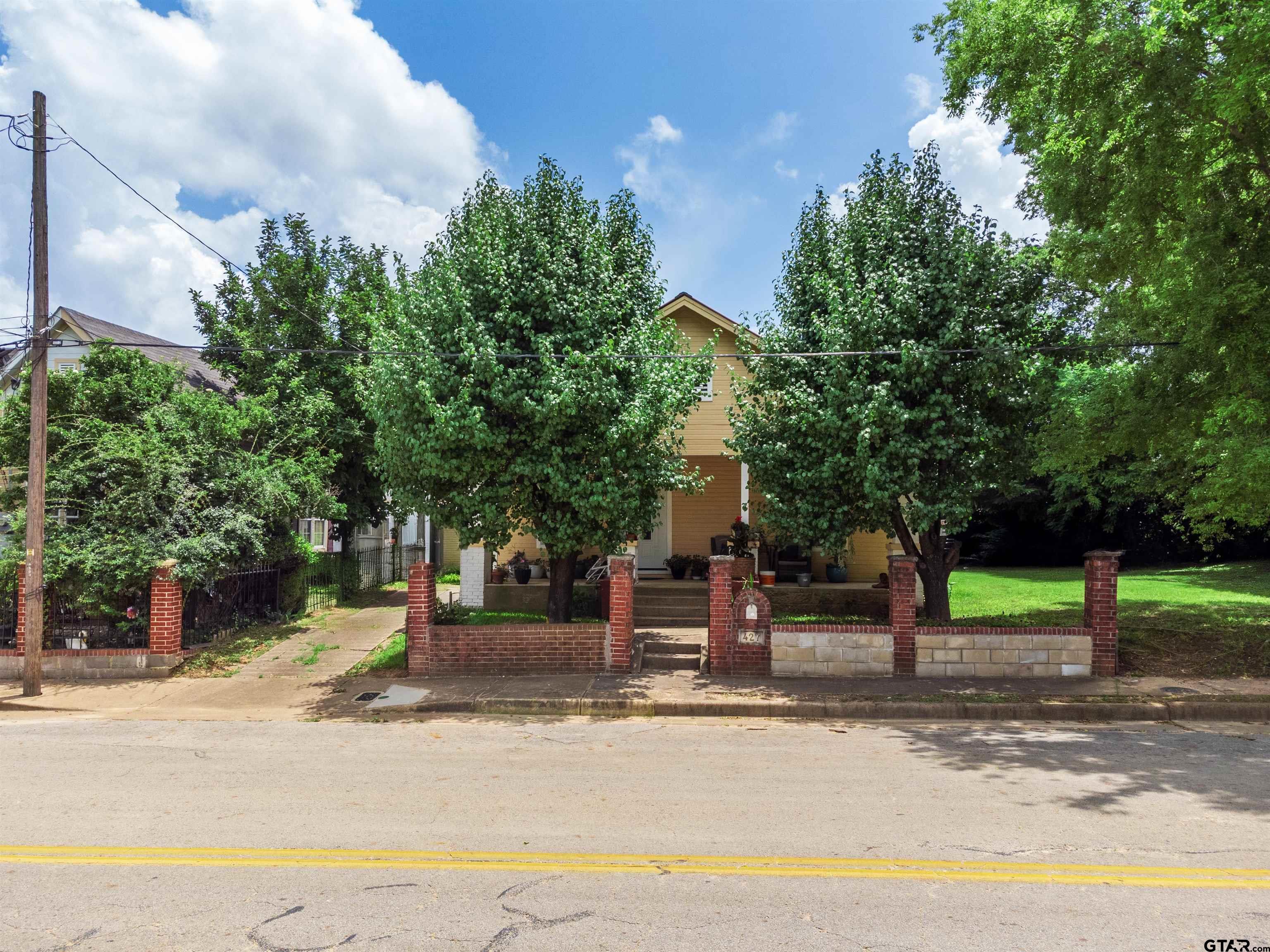 427 East Locust Street Tyler, TX 75702 - Photo 42 of 42 a front view of a house with garden