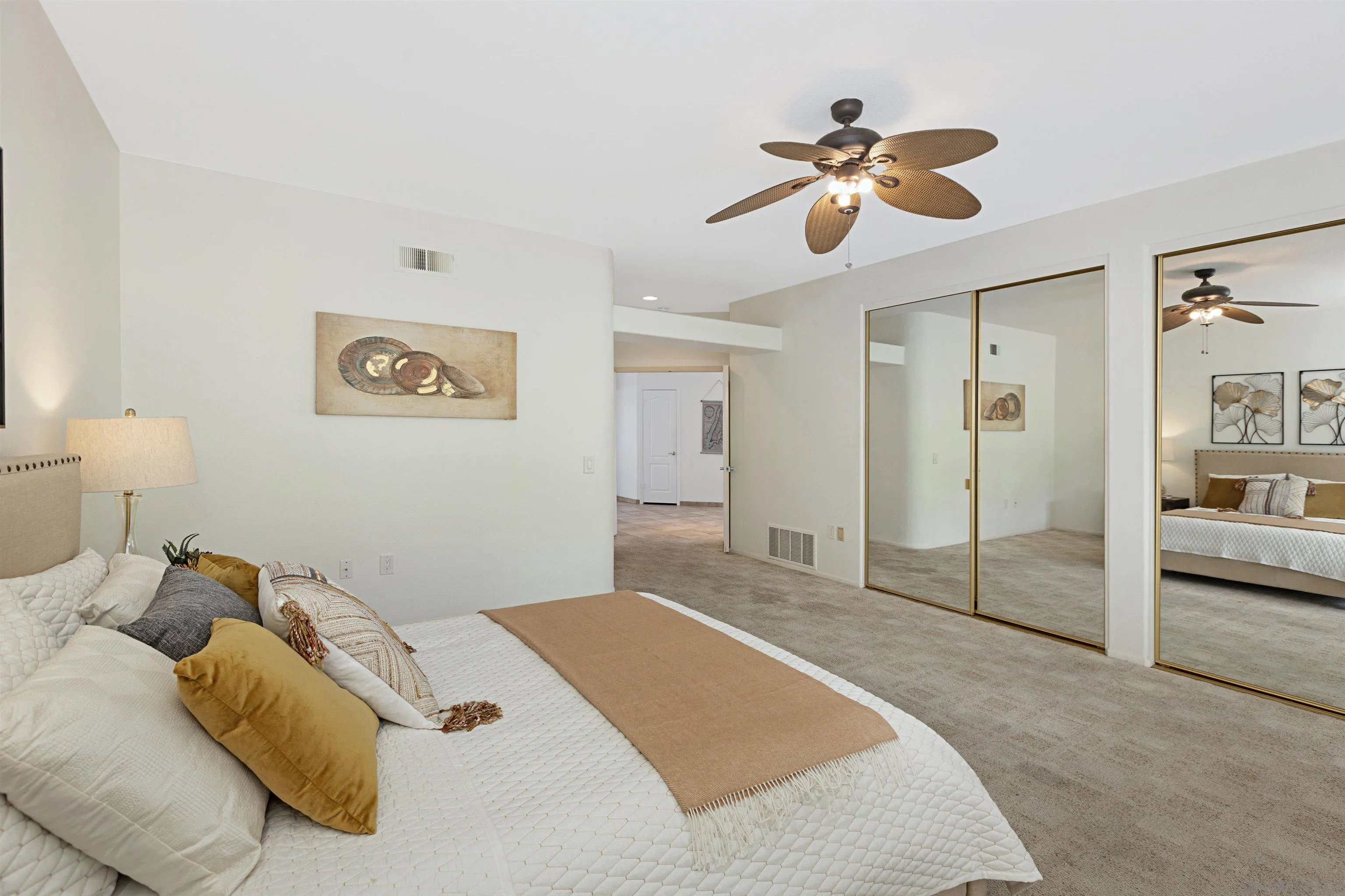 4158 Pindar Way Oceanside, CA 92056 - Photo 18 of 35 a bedroom with a large bed and ceiling fan