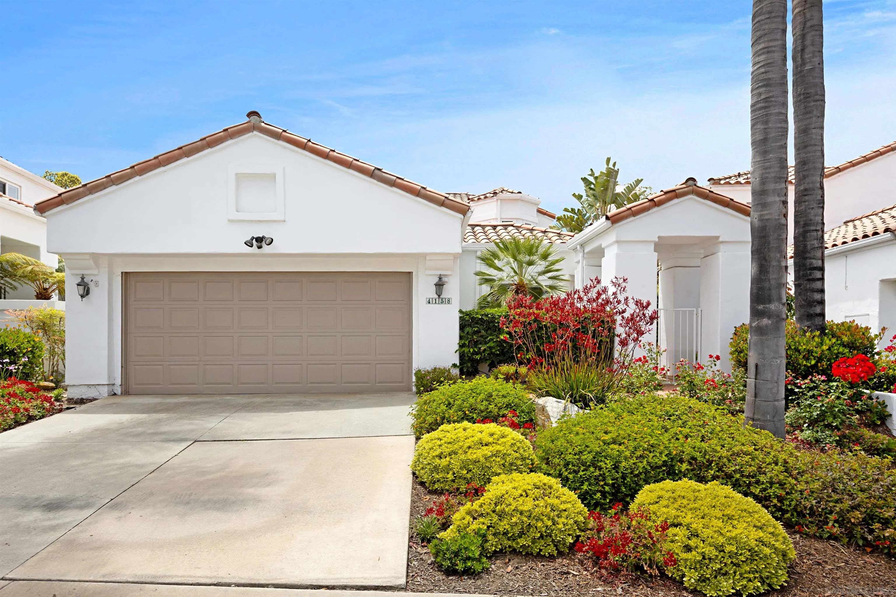 4158 Pindar Way Oceanside, CA 92056 - Photo 2 of 35 a front view of a house with a yard and garage