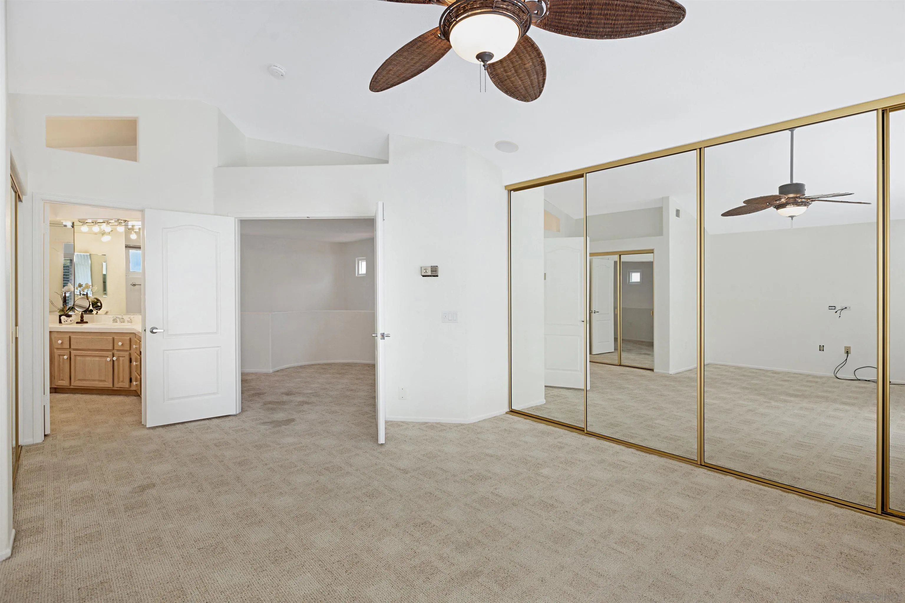 4158 Pindar Way Oceanside, CA 92056 - Photo 22 of 35 a view of a livingroom with a ceiling fan & entryway