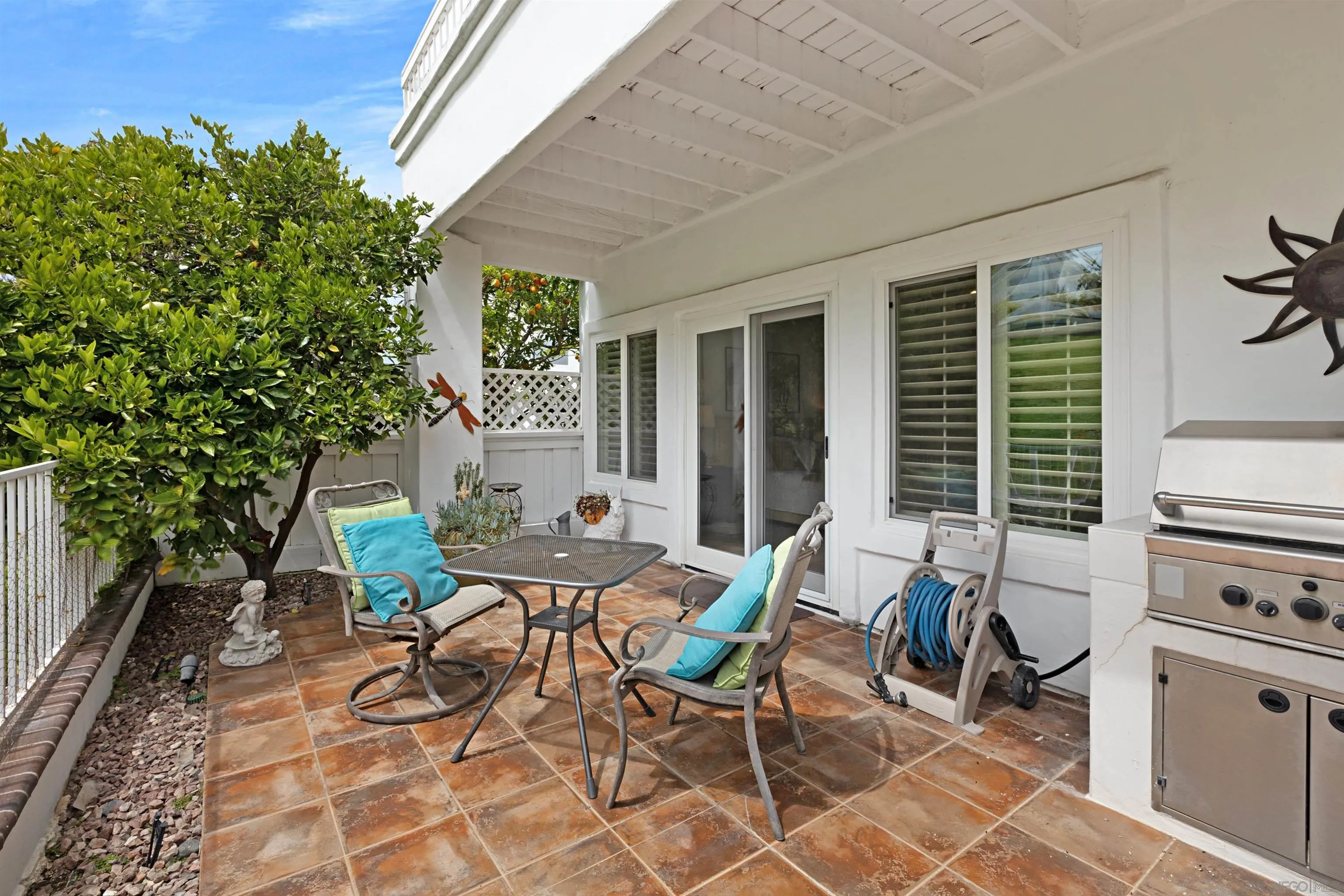 4158 Pindar Way Oceanside, CA 92056 - Photo 29 of 35 a view of a patio with table and chairs and potted plants