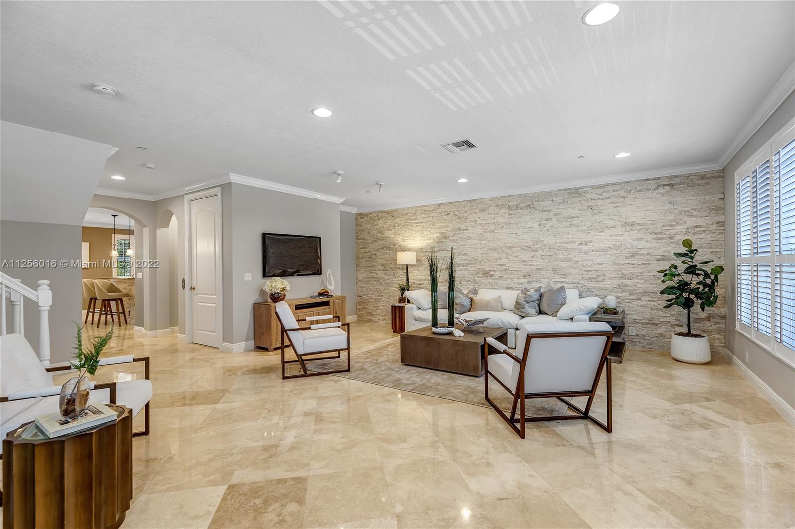5560 Northeast Trieste Way Boca Raton, FL 33487 - Photo 13 of 28 a living room with furniture