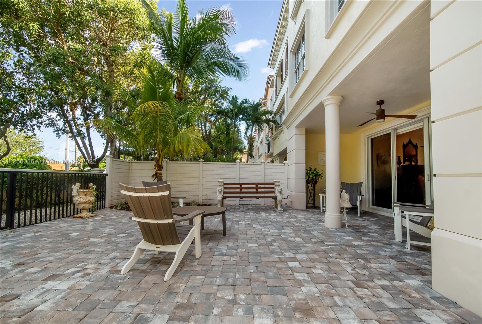5560 Northeast Trieste Way Boca Raton, FL 33487 - Photo 26 of 28 a view of a lounge chairs with a patio