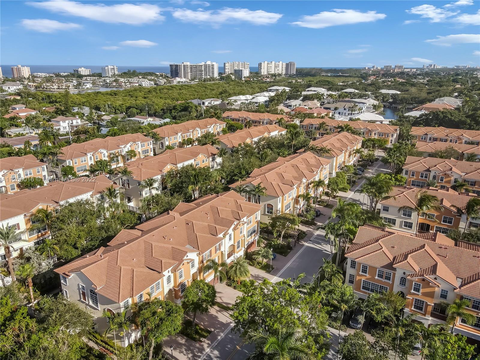 5560 Northeast Trieste Way Boca Raton, FL 33487 - Photo 5 of 28 an aerial view of residential houses with outdoor space