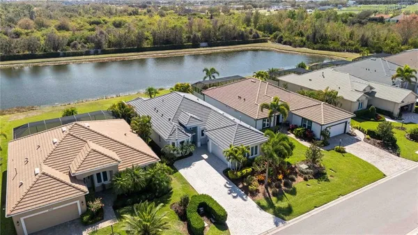 an aerial view of residential houses with outdoor space
