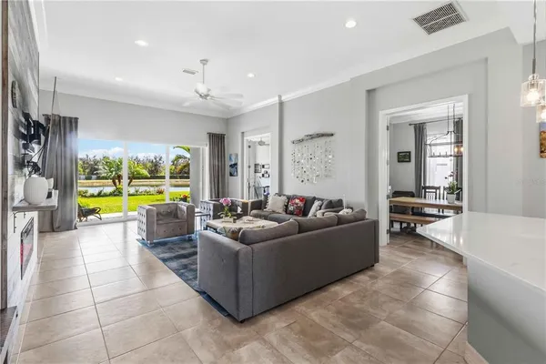 a large kitchen with granite countertop a sink stainless steel appliances and cabinets