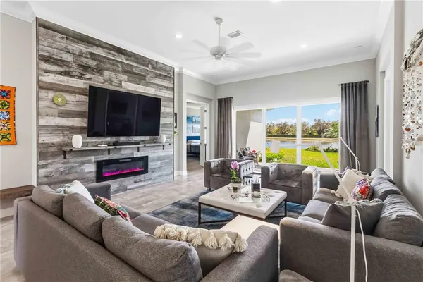 a kitchen with stainless steel appliances a sink stove refrigerator and cabinets