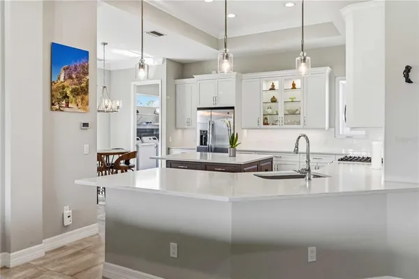 a view of a dining room with a table and chairs