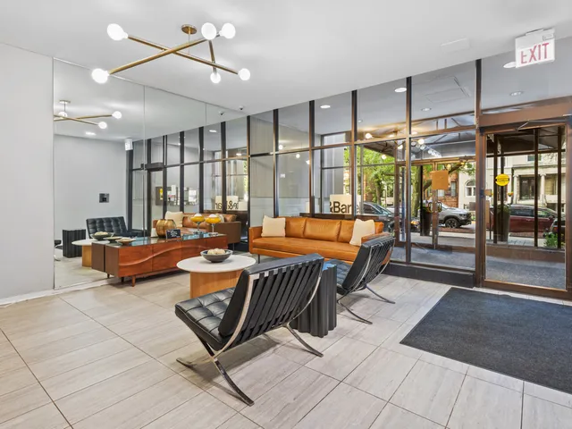 a living room with lots of furniture and a chandelier