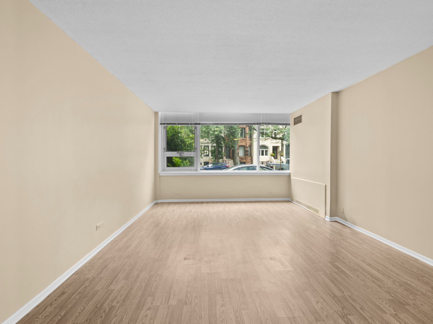 2728 North Hampden Court, Unit 109 Chicago, IL 60614 - Photo 7 of 20 an empty room with wooden floor and windows