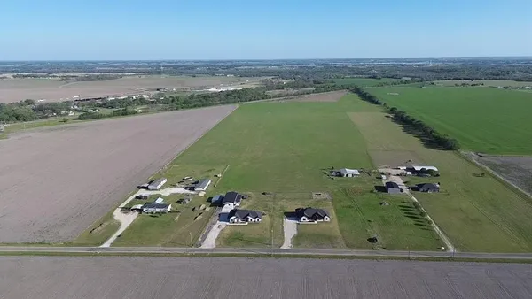 an aerial view of a house with a lake view