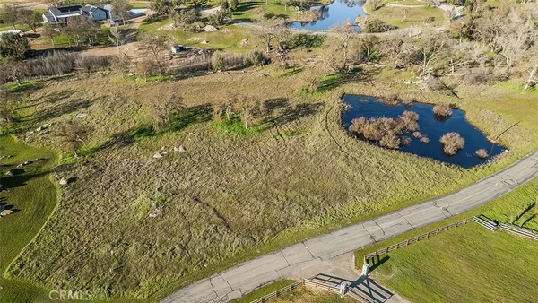 a wooden bench sitting in the middle of a lake