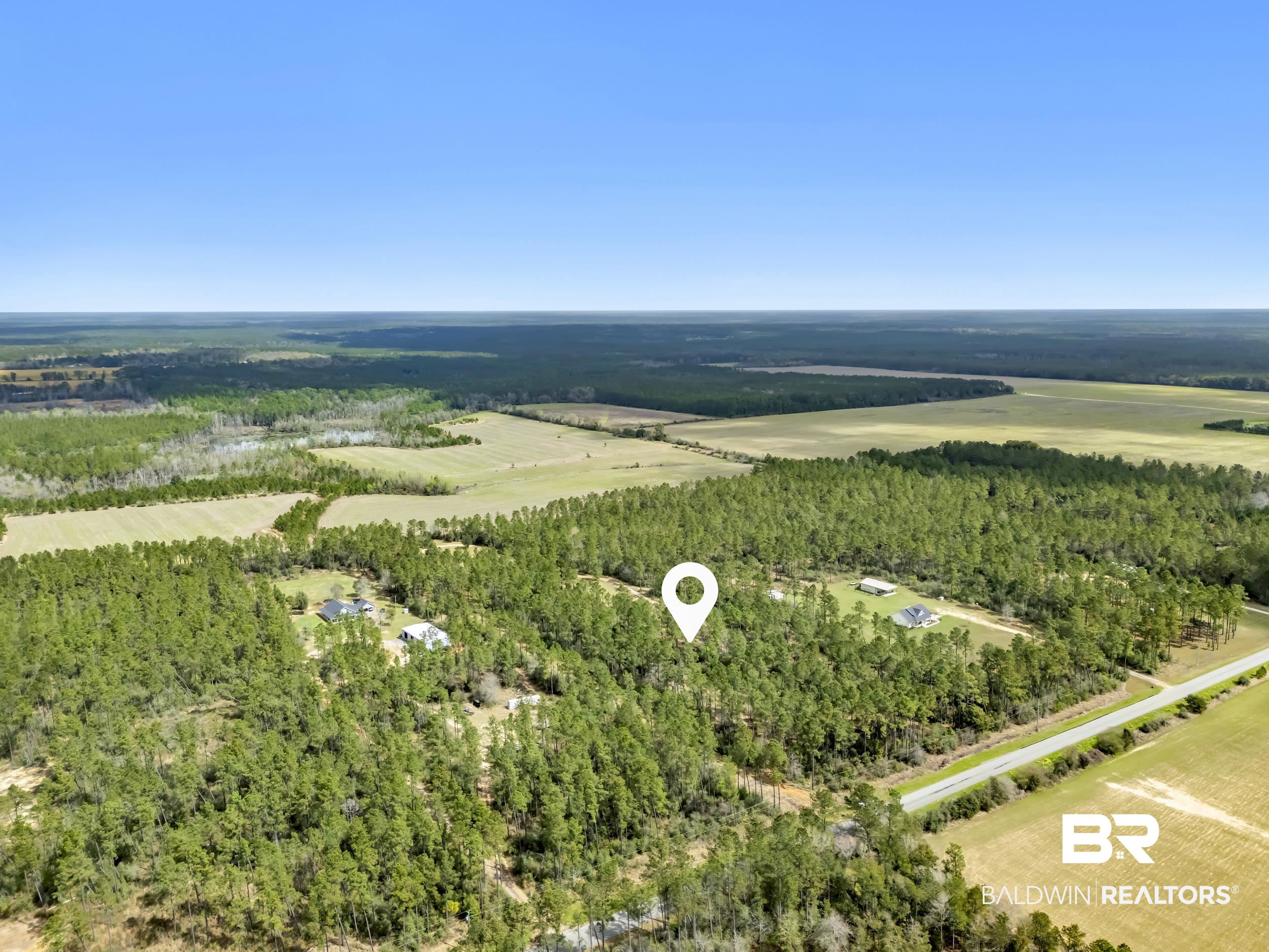 0 Gardner Road Elberta, AL 36530 - Photo 15 of 19 View of rural area with rows of crops and a heavily wooded area