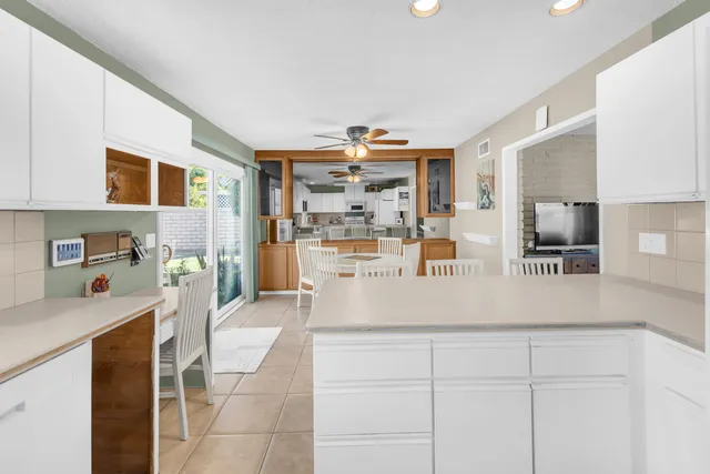 a dining table chair next to a window