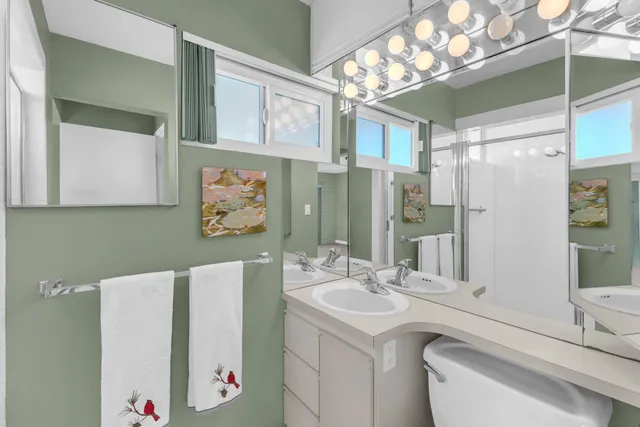 a view of a patio with couches table and chairs and a fire pit