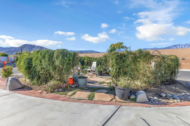 a roof deck with a table and chairs
