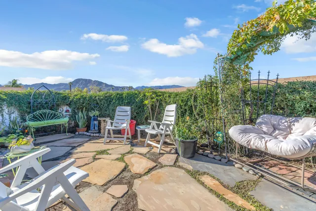 a view of swimming pool with a patio