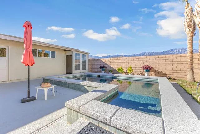 a terrace with outdoor seating and city view