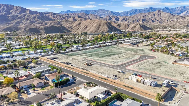 an aerial view of a house with swimming pool