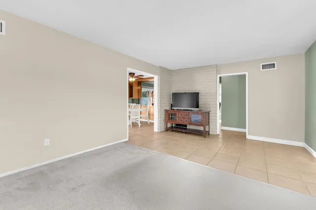 a view of a livingroom with a furniture and a flat screen tv