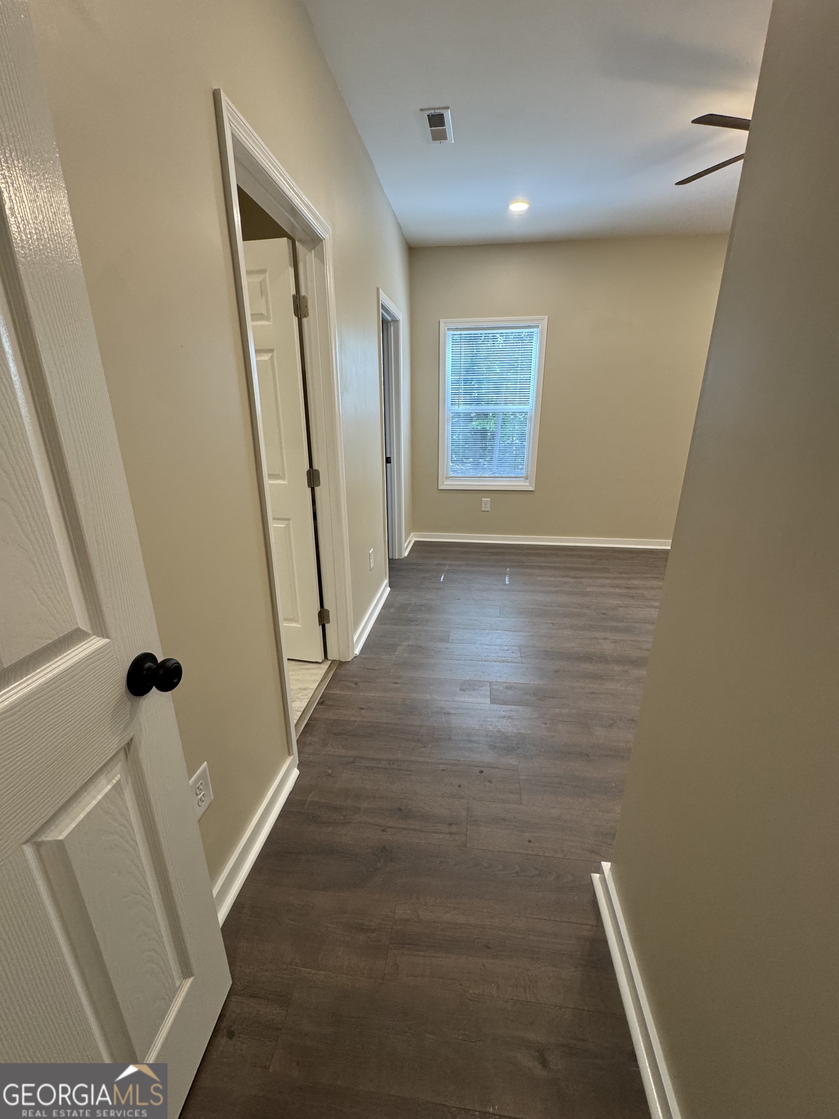 825 Mercer Drive Elberton, GA 30635 - Photo 11 of 22 an entryway of a house with wooden floor and a window