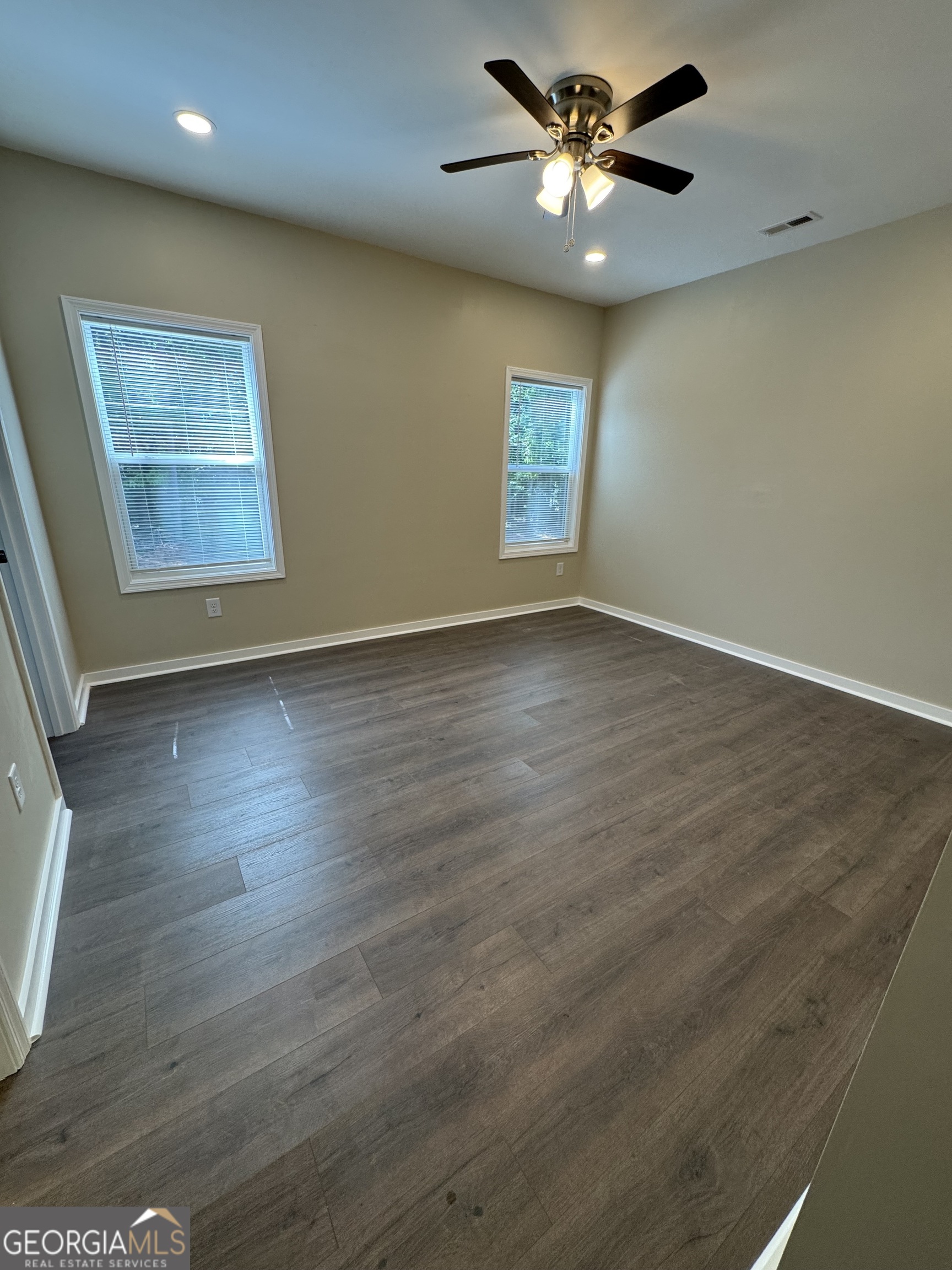 825 Mercer Drive Elberton, GA 30635 - Photo 12 of 22 wooden floor in an empty room with a window