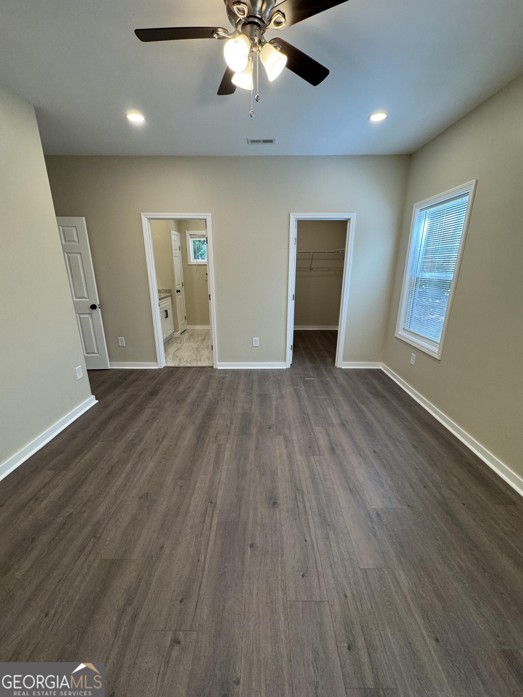 825 Mercer Drive Elberton, GA 30635 - Photo 13 of 22 an empty room with wooden floor and windows
