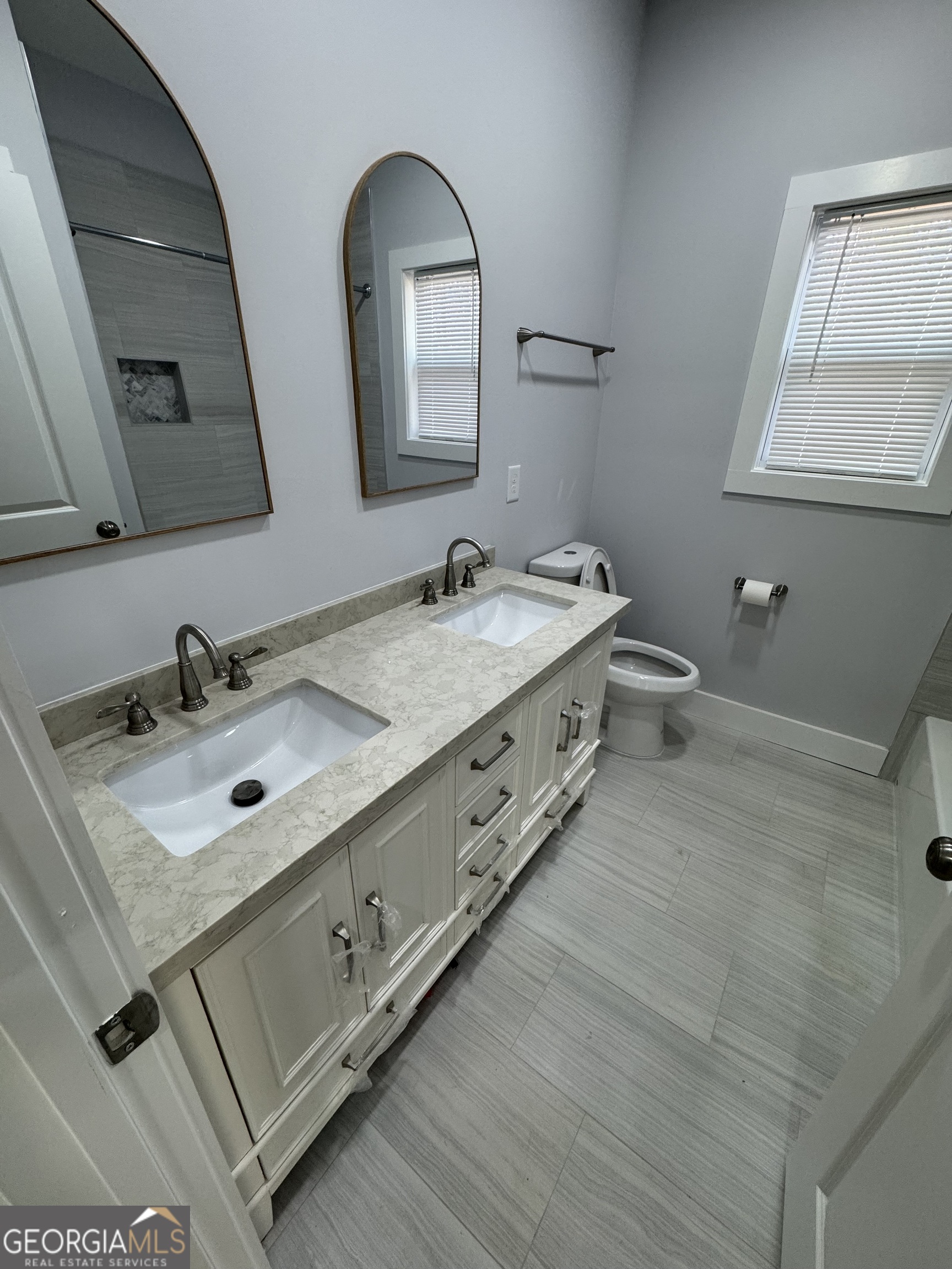 825 Mercer Drive Elberton, GA 30635 - Photo 13 of 16 a bathroom with a double vanity sink mirror and