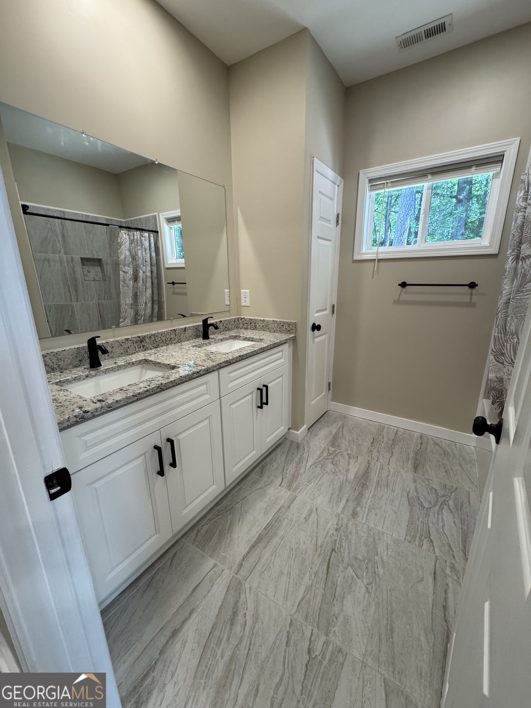 825 Mercer Drive Elberton, GA 30635 - Photo 15 of 22 a bathroom with a sink and a mirror