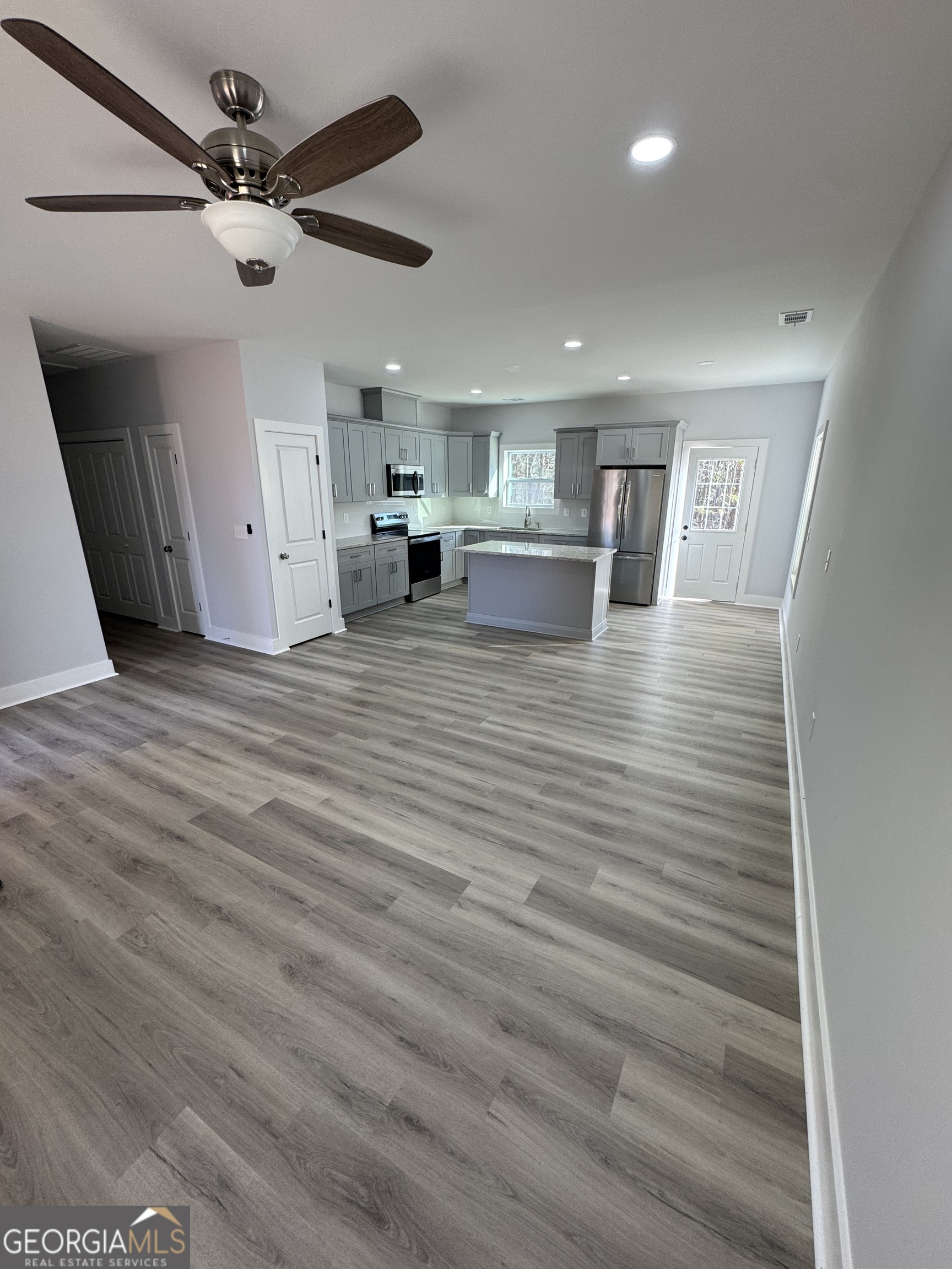 825 Mercer Drive Elberton, GA 30635 - Photo 5 of 16 a view of kitchen and livingroom with wooden floor