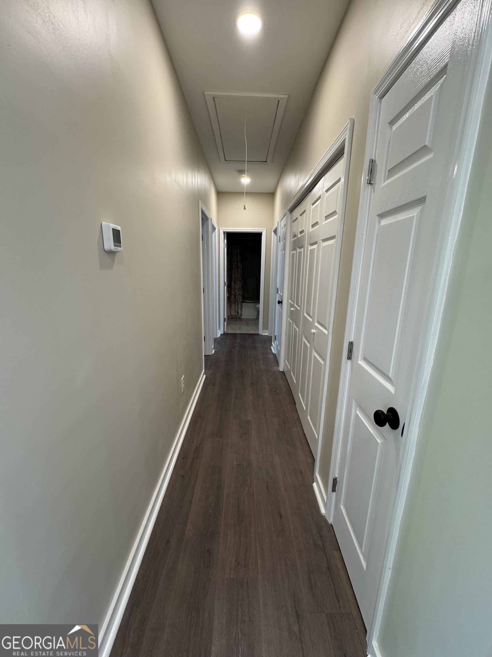 825 Mercer Drive Elberton, GA 30635 - Photo 7 of 22 a view of a hallway with wooden floor and staircase