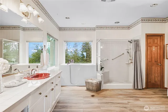 a very nice looking room with a large window and chandelier