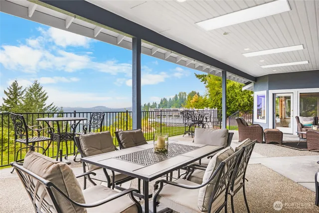 a view of a patio with a table chairs and a table