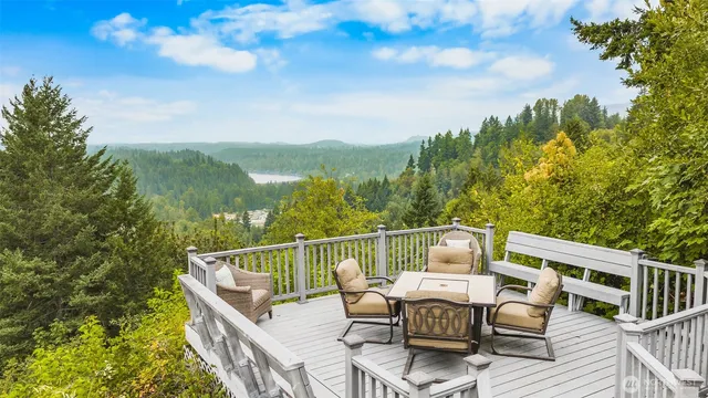 a balcony with wooden floor and city view