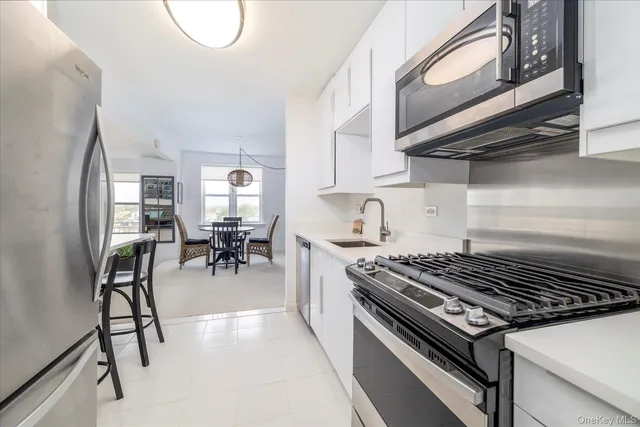 a kitchen with table and chairs