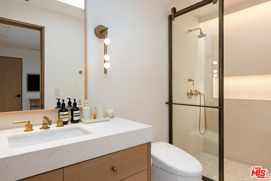 24818 Malibu Road Malibu, CA 90265 - Photo 16 of 23 a bathroom with a sink a toilet and shower