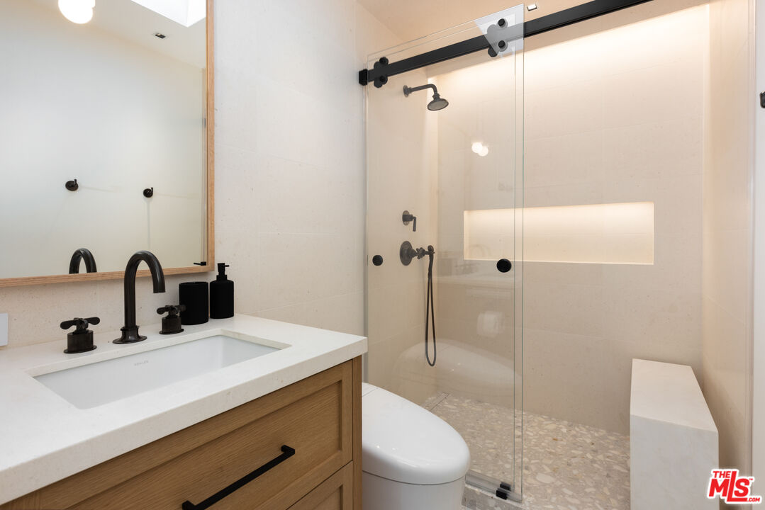24818 Malibu Road Malibu, CA 90265 - Photo 18 of 23 a bathroom with a sink a toilet and shower