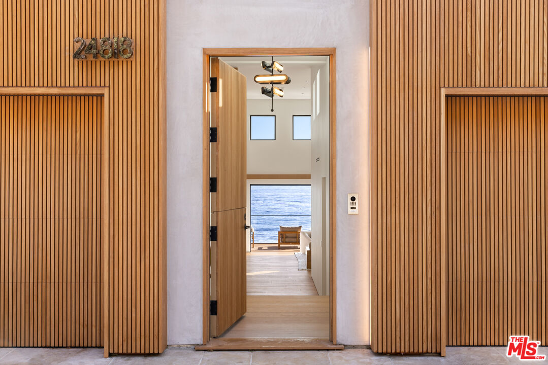 24818 Malibu Road Malibu, CA 90265 - Photo 2 of 23 an entryway door with wooden floor