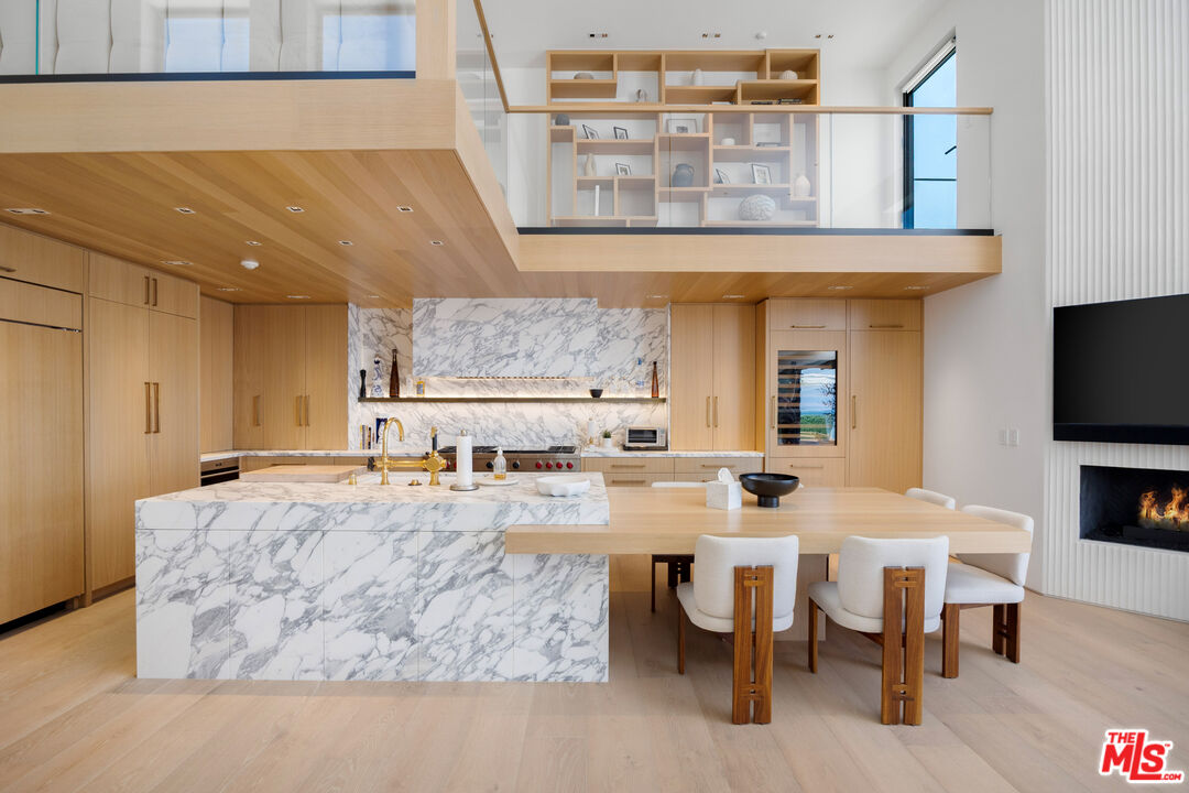 24818 Malibu Road Malibu, CA 90265 - Photo 3 of 23 a large kitchen with a table and chairs