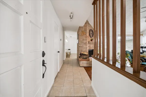 a view of a hallway with windows